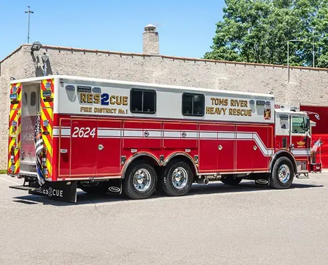Pierce walk-in rescue truck with interior access area and exterior compartments for tools and emergency equipment.